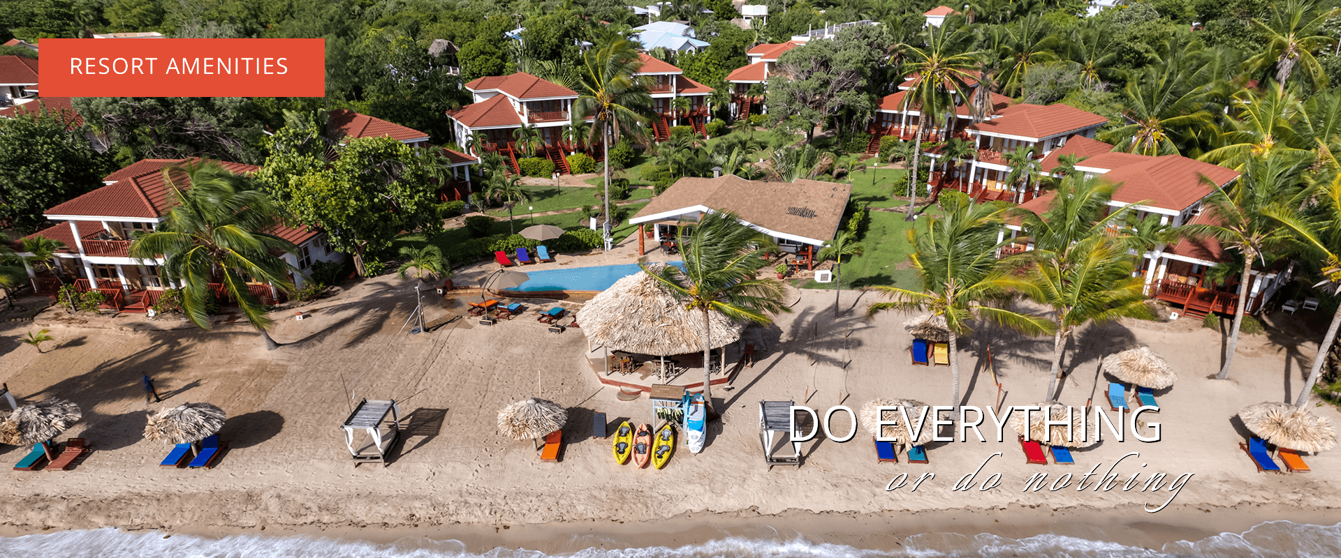 riel view of resort showing villas, beach access, and beach chairs