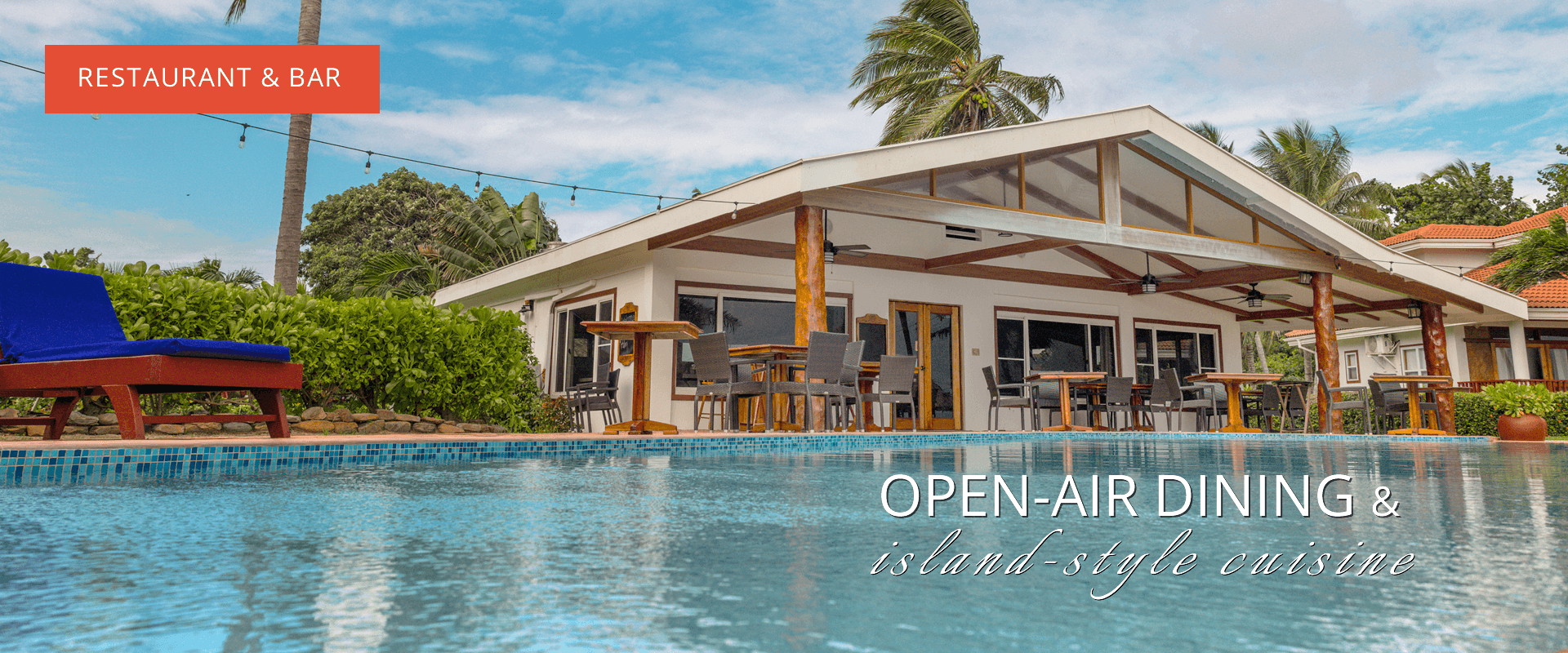 Large pool with building showing dining and pool chairs. Text says "Restaurant & Bar" and "Open-air dining & island style cuisine"